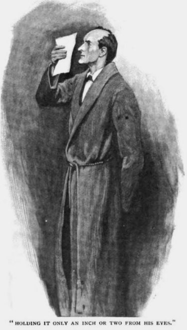 Sherlock Holmes The Hound of the Baskervilles holding it only an inch or two from his eyes